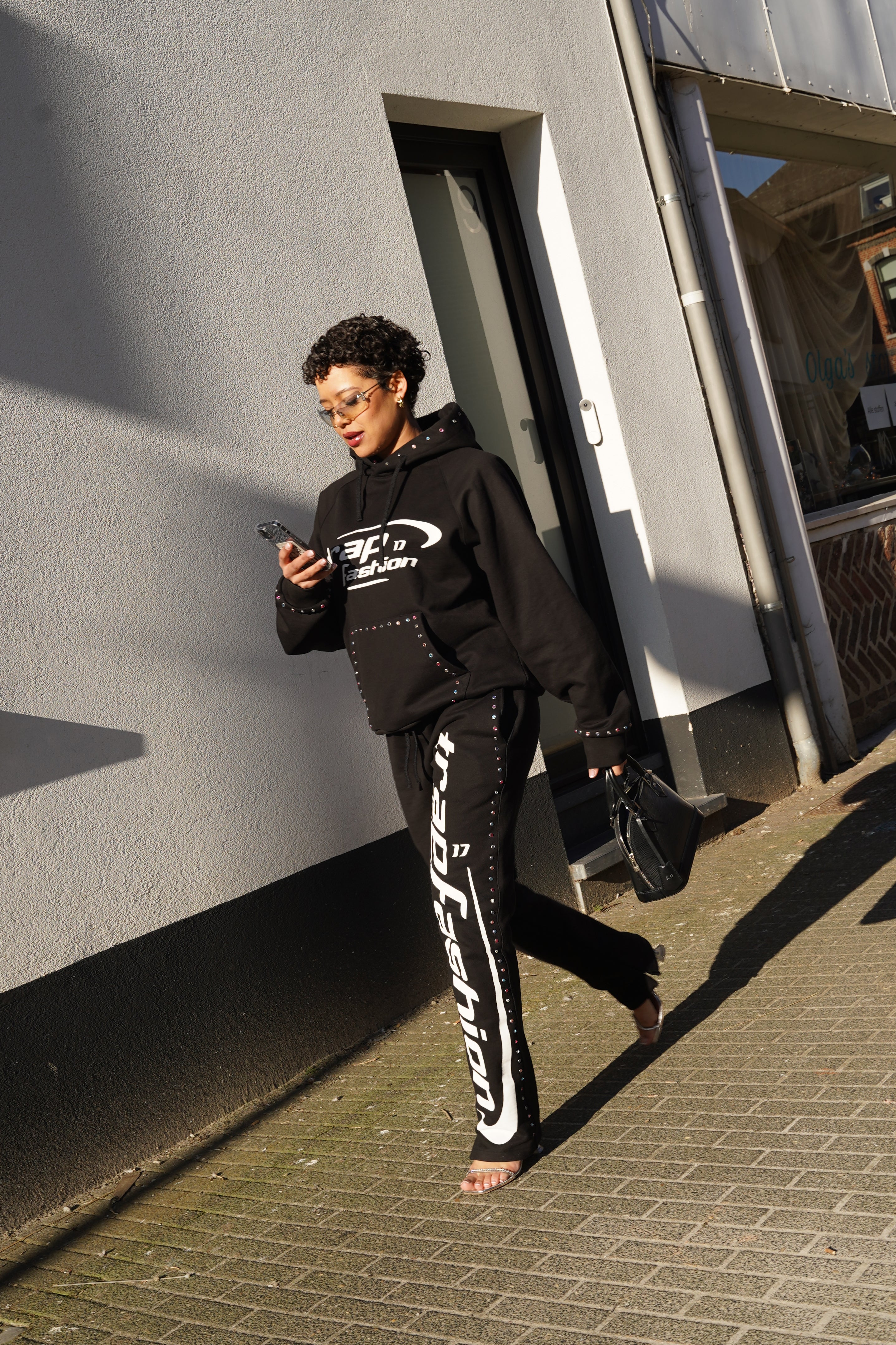 Model wearing oversized trapfashion seventeenthebrand diamond hoodie outside