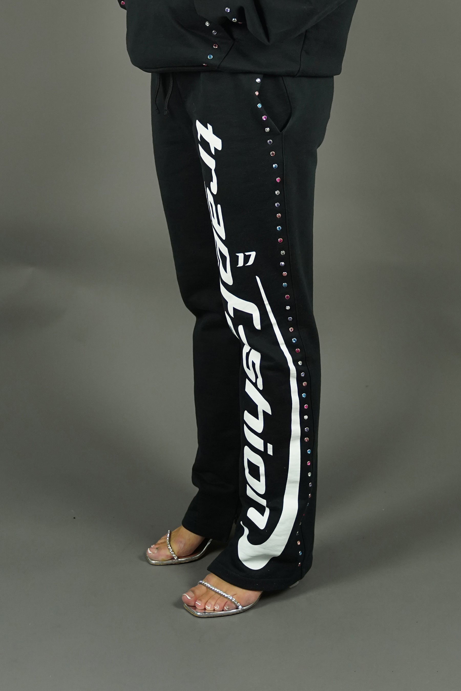 Side view of trapfashion rhinestone studded pants
