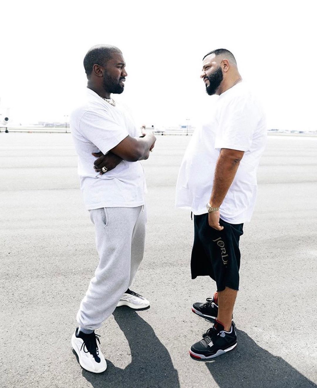 SPOTTED: KANYE WEST GIFTS DJ KHALED YZY BSKT SNEAKERS ON THE TARMAC