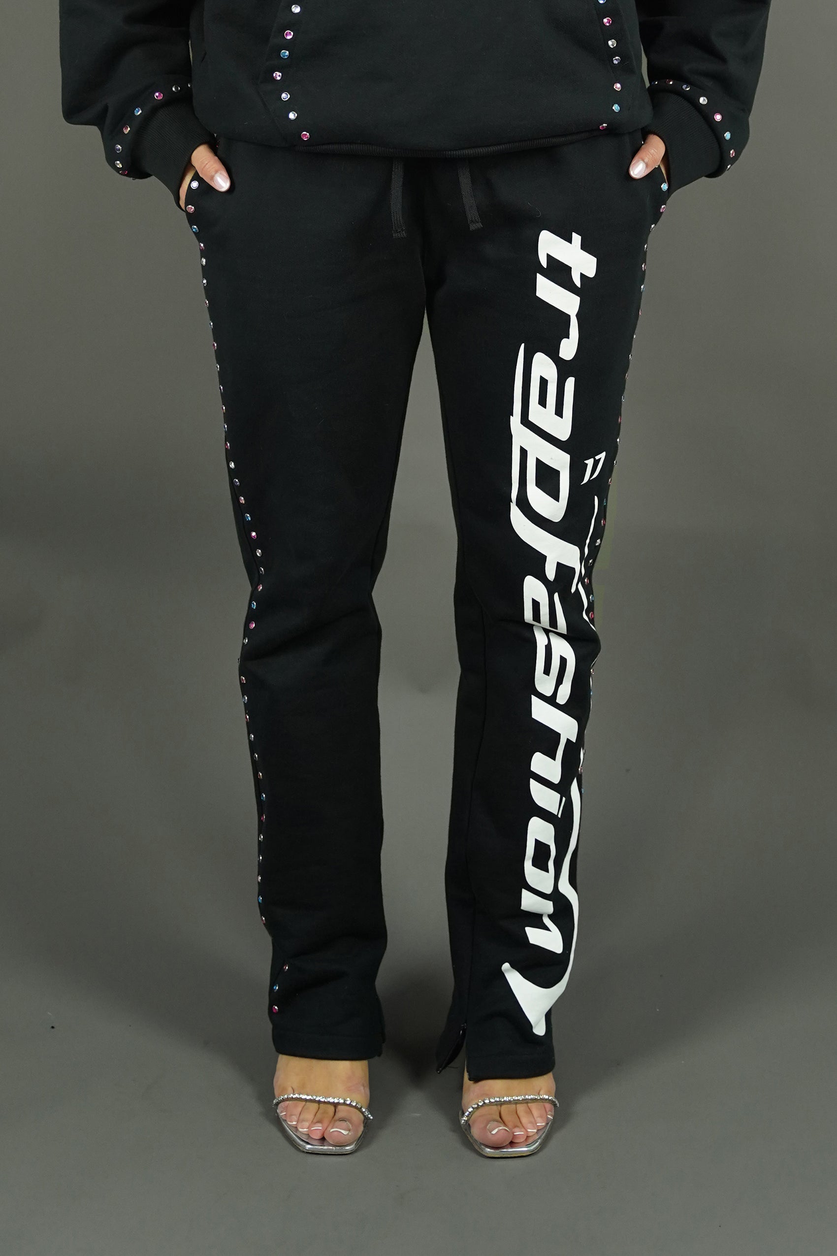 front view of the diamond rhinestone studded pants of trapfashion seventeenthebrand